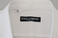 DOLCE & GABBANA Gorgeous, brand new with tags 100% Authentic Dolce & Gabbana button down formal shirt crafted from cotton features a long sleeves and collared neckline. Model: Collared long sleeve shirt Colour: White Material: 100% Cotton Fitting: Regular Fit Logo details Made in Italy