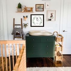 a baby's room with a crib, dresser and wall art on the walls