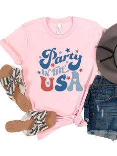 Get ready to party in style this 4th of July with our Party in the USA Patriotic T-shirt! Featuring a bold retro font in classic red and blue, this shirt is the perfect way to show your love for America while having a good time. Made from high-quality Bella + Canvas cotton blend fabric, this shirt is both comfortable and durable. Available in six different colors, you can choose the perfect shade to suit your personal style. And with sizes ranging from XS to XXXL, this shirt is sure to fit every Retro American Flag Print Summer T-shirt, Red Letter Print Shirt For Summer, Trendy Red T-shirt For Party, Spring Party Graphic Print T-shirt, Patriotic American Flag Print T-shirt For Summer, Retro Graphic Print T-shirt For 4th Of July, Retro Letter Print Tops For 4th Of July, Retro American Flag Print T-shirt For Summer, Red Shirt With Text Print For Summer