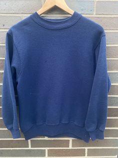 Vintage 1990s Hanes Crewneck Pullover Sweatshirt - Size S (Length 22.5" Chest 18") - Overall great vintage condition - No holes/one small stain pictured  - Message for more information Please take note of the measurements listed as these are vintage clothes and may fit different than the tag size. Follow our page for more vintage clothing drops! Connect with us on Instagram: @recurarchives Casual Solid Color Sports Sweatshirt, Casual Solid Color Sweatshirt For Sports, Sporty Tops With Funnel Neck And Ribbed Cuffs, Sporty Funnel Neck Top With Ribbed Cuffs, Sporty Top With Funnel Neck And Ribbed Cuffs, Basic Winter Sports Tops, Casual Stretch Sweatshirt For Sports, Casual Tops With Ribbed Collar For Sports, Blue Sportswear Sweats For Fall