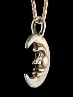 This smiling Moon Charm is cast in sterling silver. It is 7/8 inch high and fully detailed both front and back. All Marty Magic Charms and Pendants include an 18 inch (46cm) box chain. If you would prefer a different length of chain please feel free to contact me. This item usually ships the same or next business day. All Marty Magic Jewelry is packaged in a beautiful box, embossed with the gold foil Marty Magic dragon logo. Perfect for any occasion. Designed in Santa Cruz, California by Marty M Silver Half Moon Jewelry Engraved, Silver Half Moon Engraved Jewelry, Crescent Silver Jewelry With Sun And Moon Design, Silver Crescent Moon Charm Jewelry, Collectible Round Pendant With Moon Charm, Sterling Silver Crescent Jewelry With Polished Finish, Silver Moon Jewelry With Sun And Moon Design, Silver Moon Shaped Symbolic Jewelry, Celestial Silver Crescent Jewelry