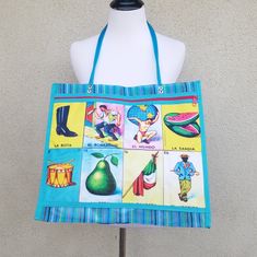 Nwot Mexican Beach, Grocery, Or On The Go Mesh Tote Bag. Features Front Zip Pocket, One Deep Main Pocket, Mexican Loteria Design, Very Sturdy And Versatile, Plastic Handles. Bright Spring And Summer Colors. Blue Shoulder Bag For Summer Market, Blue Summer Shoulder Bag, Blue Shoulder Bag For Summer, Blue Satchel Beach Bag For Travel, Blue Beach Bag With Removable Pouch For Shopping, Blue Rectangular Beach Bag With Removable Pouch, Blue Square Vacation Bag, Square Blue Vacation Bag, Blue Tote Beach Bag For Market