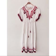 The Perfect Summer Dress!! Summer Wouldn't Be Summer Without A Breezy, Gauzy Dress. This One Features Embroidery In Pretty Shades Of Red With Tasseled Details. Lined. Like New Without Tags. $260 New. Cotton/Modal - Relaxed Fit - Apx 45” In Length, Based On A Size S. Armpit To Armpit: 18”, Waist At Largest Uncinched 18” Also. Split Neck With Tasseled Self-Tie Closure; Elastic Waist; Side Seam Pockets; Tassel Fringe. Embroidered Summer Holiday Dresses, Summer White Midi Dress With Embroidered Hem, White Midi Dress With Embroidered Hem For Summer, White Embroidered Hem Midi Dress For Summer, Spring Red Maxi Dress With Floral Embroidery, Casual Red Dresses With Floral Embroidery, Casual Red Dress With Floral Embroidery, Summer White Maxi Dress With Embroidered Hem, White Embroidered Short Sleeve Maxi Dress