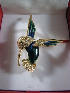 HUMMING BIRD BROOCH Signed Roman Rhinestone and emerald green enamel gold tone 2" excellent condition Green Jeweled Brooch For Gift, Green Jeweled Brooches As Gift, Green Costume Jewelry Brooches For Gifting, Green Costume Jewelry Brooches For Gift, Humming Bird, Bird Brooch, Green Enamel, Gold Enamel, Emerald Green