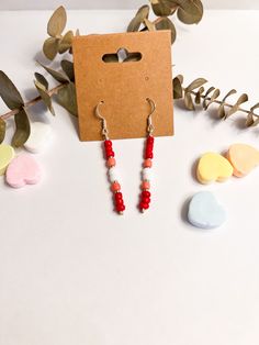 These stunning red, pink, and white stick earrings are the perfect accessory to add a pop of color to your Valentine's Day outfit! ✨💖 Measuring approximately one and a half inches in length, these earrings are lightweight and comfortable to wear all day long. The vibrant red and white color scheme makes them a great statement piece for any occasion, especially Valentine's Day. 💌 These earrings are the perfect gift for anyone who loves handmade, jewelry, and unique accessories. They come carefu Trendy Red Beaded Earrings As Gift, Trendy Red Beaded Earrings For Gift, Stick Earrings, Unique Accessories, Valentine's Day Outfit, Accessories Unique, Vibrant Red, Seed Bead, Pink And White