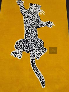 a yellow rug with a black and white silhouette of a woman in leopard print on it