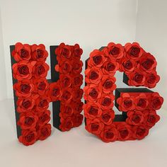 the letters are made out of paper roses