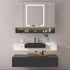 a bathroom with a sink, mirror and shelf on the wall next to each other