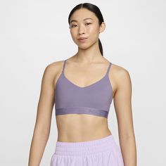 Don't let anything get in the way of expressing yourself in this sleek, low-profile sports bra. Its light support gives you a gentle hold with plenty of freedom that's great for low-impact workouts or all-day comfort. Smooth, quick-drying fabric gives the bra a clean finish so you can wear it your way. Nike Sports Bra With Built-in Bra For Training, Nike Yoga Sports Bra With Built-in Bra, Nike Sports Bra With Built-in Bra For Yoga, Activewear With Removable Bra Pads For Light Exercise, Athleisure Bra For Light Sports With Medium Support, Sporty Sports Bra With Removable Pads For Light Exercise, Nike Medium Support Sports Bra In Athleisure Style, Nike Sports Bra With Moisture-wicking Medium Support, Sporty Bra With Medium Support For Light Exercise