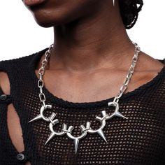 Juanita Care is an independent avant-garde jewelry and vegan accessories born in France, 2017. Punk aesthetic meets artistic freedom, a fusion of fear, desire, revolt, and seduction. Each piece embodies the poetry of evolving bodies. Welcome to a realm where expression knows no bounds. Necklace inspired by the handles of ceramic vases, connected to a chain of rectangular links. Polished 925 silverMaterial: Sterling silver, polished finish,T claspDimensions: Length (open) S — 60cm, M — 70cm Edgy Handmade Necklaces For Party, Punk Style Necklaces For Festivals, Handmade Edgy Jewelry For Party, Edgy Handmade Jewelry For Parties, Punk Chain Jewelry For Alternative Fashion, Punk Style Chain Jewelry For Alternative Fashion, Handmade Edgy Necklaces For Alternative Fashion, Metal Jewelry For Alternative Fashion, Edgy Handmade Necklaces For Alternative Fashion