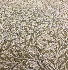 a close up view of the fabric with an intricate design on it's surface