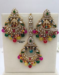 Premium Quality meenakari  Kundan Earrings and Tikka Set/ Indian Jewelry/ Bollywood Jewelry/ High Quality Jewelry All items are shipped from Brampton, Ontario, Canada. If you need your item by a certain day, please reach out to us for express delivery option before placing the order so that we can update the shipping for you. Standard shipping/delivery timeline Below are the estimated delivery times after the order is shipped/dispatched.  ---> USA delivery timeline * 3-6 business days to major u Traditional Multicolor Danglers For Celebration, Traditional Multicolor Chandbalis For Celebration, Traditional Kundan Multicolor Earrings, Multicolor Kundan Earrings With Meenakari, Traditional Multicolor Kundan Earrings, Multicolor Temple Jewelry Bridal Earrings With Latkans, Multicolor Bridal Earrings With Latkans In Temple Jewelry Style, Multicolor Temple Jewelry Earrings For Ceremonial Occasions, Multicolor Bollywood Bridal Earrings With Meenakari