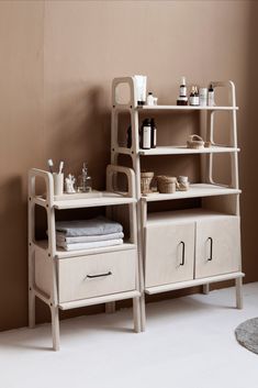 a bathroom with a shelf and drawers in it