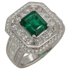 This emerald and diamond ring is truly an object of luxury. Featuring an impressive 1.95 carat emerald set with sparkling white diamonds, it is a statement piece that is sure to get you noticed. This exclusive emerald and diamond ring was made with the finest quality materials, to ensure that it is both elegant and durable. The emerald on its own is truly impressive, paired with the 2.24 carat diamond princess and 0.44 carat diamond round for a total of 2.68 carats of diamonds. This timeless pie Emerald Set, Diamond Princess, Emerald Diamond Ring, Jeweled Earrings, Princess Diamond, Emerald Diamond, White Diamonds, Quality Diamonds, Cocktail Rings