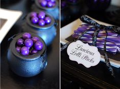 there are purple and black candy in small pots