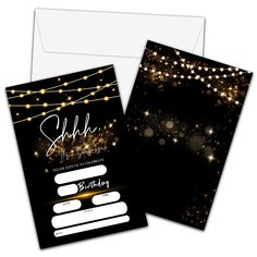 a black and gold birthday card with string lights on the front, and white envelope