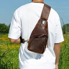 Crazy Horse Leather Chest Bag for Men's Leisure Retro Style Crossbody Bag Top Layer Cowhide Shoulder Bag Commuter Outdoor Leisure Bag PRODUCT INFORMATION --------------------------------------------- --Product Size: 34x9x17 cm--13.38x6.69x3.54 inch; --Item Weight:0.6 kg/1.32lb --Max fit for iPad 8.3inch --High-Quality Stitching This bag has an adjustable shoulder strap. On the back of the crossbody bag are two hooks for both the left and right shoulders ✔The ultimate grab-and-go daypack, this brown leather crossbody bag is built to be an upgrade on overstuffed pockets. ✔It's made from genuine full grain buffalo leather, the highest grade available. That means the very top layer of the hide only is used. Buffalo leather is the strongest and thickest type available. This gives it the longest Leather Chest Bag With Adjustable Strap For Outdoor, Brown Portable Chest Bag For Outdoor, Rectangular Outdoor Chest Bag With Anti-theft Pocket, Crossbody Backpack With Anti-theft Pocket For Outdoor Activities, Outdoor Crossbody Backpack With Anti-theft Pocket, Crossbody Chest Bag With Anti-theft Pocket For Outdoor Activities, Crossbody Chest Bag With Anti-theft Pocket For Outdoor, Everyday Carry Backpack With Adjustable Strap, Functional Leather Chest Bag For Outdoor Activities