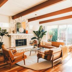 a living room filled with furniture and a fire place in the middle of a room