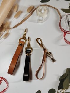 This is the perfect wristlet used to hold all your keys, with the brass hook also allowing the ability to secure your keys in your purse if you so choose! Brown Keychain With Key Leash For Everyday Use, Gold Adjustable Wristlet For Everyday Use, Gold Keychain With Key Leash For Everyday Use, Everyday Gold Keychain With Key Leash, Adjustable Wristlet With Key Leash For Daily Use, Gold Wristlet With Wrist Strap For Everyday Use, Adjustable Wristlet With Key Clip As Gift, Gold Keychains With Key Clip For Everyday Use, Gold Keychain With Key Clip For Everyday