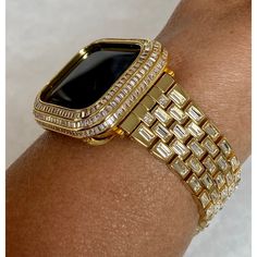 Bling Hand Made Apple Watch Band Style Replacement. Fits the Apple Watch available for sizes 38,40,42 and 44mm in series 1,2,3,4,5,6 or SE Men's & Women's. This is a custom design made to fit the Apple Watch, it is not a brand copy. Custom Apple Watch Band with Large Swarovski Crystal Baguettes Stones. This is high on the bling with a yellow gold stainless steel band that features rows of high quality hand set baguette stones. For the ultimate in sparkle, add the 14k Gold Plated pave lab diamond Luxury Bling Watch Accessories For Gift, Luxury Embellished Watch Accessories For Gift, Apple Watch Cover, Gold Apple Watch Band, Custom Apple Watch Bands, Gold Apple Watch, Diamond Baguette, Ceramic Watch, Gold Apple