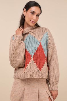 As the snow falls, cozy up in the Little Lies Cabin Cuteness Taupe Multi Diamond Pattern Pullover Sweater! Chunky, cotton-blend knit shapes a darling, multicolored diamond pattern, framed by long sleeves with drop shoulders and fitted cuffs. Relaxed bodice has a mock neckline and a lightly cropped hem. Ribbed knit at neckline, cuffs, and hem. Fit: This garment fits true to size. Length: Size small/medium measures 21" from shoulder to hem. Bust: Great for any cup size. Waist: Not Fitted - comfortable room throughout midsection. Undergarments: May be worn with any standard bra. Fabric: Fabric is very stretchy. Unlined. 65% Cotton, 35% Viscose. Cold Water Wash With Similar Colours. Do Not Bleach. Dry Cleanable. Do Not Tumble Dry. Imported. Lulus | Cabin Cuteness Taupe Multi Diamond Pattern Pu Cozy Argyle Pattern Long Sleeve Sweater, Cozy Long Sleeve Argyle Sweater, Winter Argyle Pattern Tops, Winter Argyle Knit Sweater, Knit Sweater With Argyle Pattern And Long Sleeves, Snow Falls, Sweater Chunky, Mock Neckline, Pattern Sweater