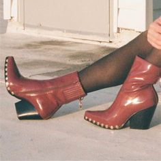 Jeffrey Campbell L 7.5 Walton Red Patent Gold Studded Pointed Cowboy Boot Bootie. Fits Approximately : 7.5 Medium; Label States 7.5m - See Measurements. Width : 3-1/8” Measured Across Widest Part Of Outsole Length : 10.5” Measured Along Insole Shaft Height : 6.5” Heel Height : 3.25” Nib. Excellent Condition. Never Worn. 0160acc New To Poshmark? Use Code "Shesabettie" For $10 Off Your First Purchase! Edgy Studded Pointed-toe Boots, Burgundy Platform Boots With Round Toe For Fall, Chic Red Platform Boots For Fall, Trendy High Ankle Boots With Red Sole, Burgundy Platform Boots For Fall, Red Leather Snip Toe Mid-calf Boots, Red Platform Boots With Reinforced Heel For Party, Trendy Snip Toe Boots With Reinforced Heel, Red Round Toe Mid-calf Boots For Fall