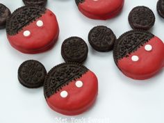 an image of red and black cookies with oreos on them that look like mickey mouses