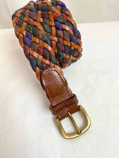 Very cool braided, woven leather belt with colorful fabric. This one has a nice width, a bit thicker than some of the others I have listed right now. It has a good authentic style about it. Well made. No flaws noticed. Brass buckle  It is a more "open size " because it has no actual punch holes. Looks best at or around 32"-34" waist setting.  Belts: I measure length of strap and then to assure fit, I measure from the tooth to the punch holes. Please measure your actual waist. It's not accurate t Casual Adjustable Braided Belt, Casual Brown Woven Belt, Vintage Adjustable Multicolor Belts, Casual Braided Leather Belt, Casual Brown Woven Leather Belt, Adjustable Multicolor Leather Belts, Casual Multicolor Adjustable Belt, Casual Multicolor Fabric Belt, Colorful Fabric