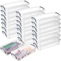 six clear storage bins filled with pens and pencils