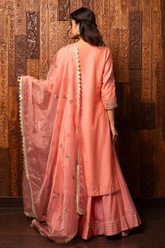 Pink silk chanderi kurta with floral embroidered patterns. Comes with chanderi embroidered palazzo and embroidered organza dupatta.
Components: 3
Pattern: Embroidered
Type Of Work: Floral
Neckline: Notched
Sleeve Type: Three Quarter
Fabric: Kurta, Palazzo - Silk chanderi, Dupatta - Organza
Color: Pink
Other Details: 
Scalloped lace hem dupatta
Attached lining
Model Height: 5ft 7inches, wearing size M
Weight: 1500 gms
Occasion: Sangeet - Aza Fashions Embroidered Slub Silk Palazzo Set, Designer Slub Silk Kurta With Floral Embroidery, Designer Raw Silk Sharara With Floral Embroidery, Designer Chanderi Sharara With Floral Embroidery, Designer Wear Floral Embroidery Palazzo Set In Raw Silk, Floral Embroidered Slub Silk Kurta For Designer Wear, Festive Chanderi Sharara With Floral Embroidery, Traditional Cotton Silk Palazzo Set With Resham Embroidery, Art Silk Sharara With Floral Embroidery And Straight Kurta