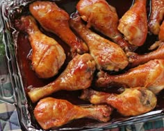 chicken wings in tin foil sitting on a table