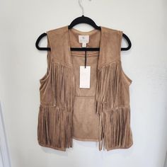 New With Tags Lila Rose Boho Faux Suede Fringe Vest Size: Medium Color: Tan Material: 90% Polyester; 10%Spandex Lila Rose Tan Faux Suede Vest Featuring Two (2) Layers Of Fringe. Super Light Weight; Soft Fabric. Perfect For Festivals, Halloween Costumes. Has Gypsy Or Country Western Vibes. Fitted Beige Outerwear For Festivals, Beige Spring Festival Outerwear, Beige Festival Outerwear For Spring, Chic Spring Festival Outerwear, Chic Festival Outerwear For Spring, Chic Fitted Outerwear For Festivals, Chic Fitted Festival Outerwear, Fitted Fringe Vest For Spring, Fitted Fringe Vest For Fall