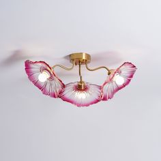 a ceiling light with pink flowers on it