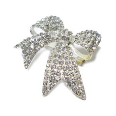 This Rhinestone Brooch features a classic ribbon style. Versatile and ready to use for floral centerpieces, displays, and crafts. Le Prise™ Color: Silver | Le Prise™ Fakenham Rhinestone Brooch 2.0 H x 2.0 W x 0.5 D in Silver | 2" H X 2" W X 0.5" D | Wayfair Silver Bow Brooch For Wedding, Rhinestone Pins For Wedding, White Rhinestone Brooches For Formal Occasions, Elegant Crystal Pins For Party, Formal White Brooches With Rhinestones, Formal White Rhinestone Brooches, Wedding Pins With Rhinestones, Silver Brooch With Decorative Bow For Party, Silver Brooch With Decorative Bow