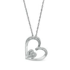 Bring the romance to your style with this sweet tilted heart pendant. Fashioned in sterling silver, this design showcases a heart-shaped outline shimmering with diamond-accented beaded ribbons. At the center, a beaded frame wraps a heart-shaped composite of diamond accents - each artfully set to enhance size and sparkle. Polished to a bright shine, this pendant suspends askew along an 18.0-inch rope chain that secures with a spring-ring clasp. Heart Pendant Necklace With Diamond Accents For Valentine's Day, Valentine's Day Sterling Silver Diamond Pendant Necklace, Nickel-free Heart Pendant Necklace For Valentine's Day, Heart-shaped Cubic Zirconia Necklace With Adjustable Chain, Heart-shaped Diamond Accented Pendant Necklace For Valentine's Day, Double Heart, Rope Chain, Showcase Design, Spring Rings