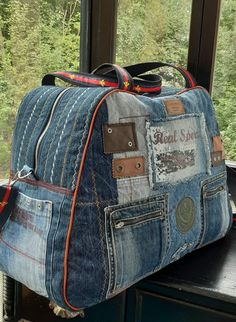 a denim bag sitting on top of a window sill