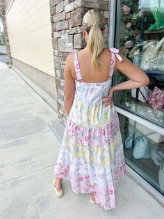 Introducing the Garden Picnic Floral Color-Block Dress! This beautiful dress features a stunning floral print and tiered ruffle design, perfect for any summer outing. The tie straps add a cute touch while keeping you comfortable. Feel confident and stylish in this must-have casual summer dress! Color-block Tired Tie Straps Ruffles Lilah is wearing a size small! Sleeveless Tiered Dress With Adjustable Straps For Brunch, Pink Sundress With Square Neck And Tie Straps, Pink Square-neck Sundress With Tie Straps, Pink Square Neck Sundress With Tie Straps, Spring Tiered Sundress, Casual Tiered Mini Dress For Garden Party, Brunch Tiered Dress With Adjustable Ruffled Straps, Summer Tiered Cotton Dress For Vacation, Summer Cotton Tiered Dress For Vacation