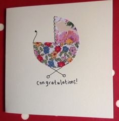 a congratulations card with a baby's stroller on it