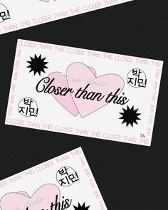 two pink stickers with black and white writing that say closer than the closer than this