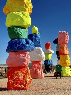 colorful rocks stacked on top of each other in the desert