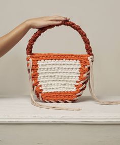 Experience the art of handwoven perfection with the hobo bag. Skillfully crafted by artisans, these bags are not only beautiful but also functional. Rectangular Natural Bucket Bag With Intrecciato Weave, Everyday Rectangular Bucket Bag With Intrecciato Weave, Square Woven Leather Shoulder Bag For Everyday, Everyday Square Woven Leather Shoulder Bag, Top Handle Crochet Bag With Woven Leather, Chic Orange Rectangular Bucket Bag, Natural Color Woven Leather Hobo Bucket Bag, Chic Handwoven Hobo Tote Bag, Everyday Bucket Bag With Intrecciato Weave