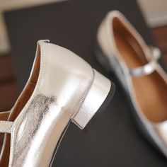 Square toe leather shoes are the perfect accessory to any outfit. They are comfortable and stylish. and they can be dressed up or down to suit any occasion.Silver mary jane shoes are a beautiful option that will add a touch of elegance to any look. The leather upper is soft and supple. and the square toe gives the shoes a modern edge. Whether you're wearing them to the office or out on the town. silver mary jane shoes are sure to turn heads. Upper: Leather Lining: Leather Outsole: TPR Toe: Squar Fall Party Mary Janes, Classic Round Toe Mary Janes For Party, Classic Mary Janes With Round Toe For Parties, Classic Closed Toe Mary Janes For Party, Metallic Silver Round Toe Heels For Spring, Spring Party Mary Janes With Almond Toe, Silver Mary Jane Heels For Spring, Silver Mary Jane Heels For Party, Spring Silver Mary Jane Heels