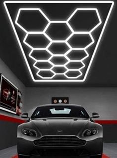 a car is parked in a garage with the lights on