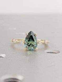 a ring with an oval cut blue diamond