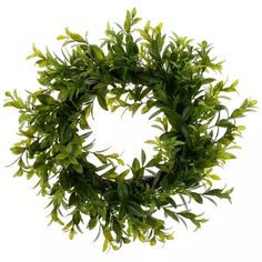 a wreath with green leaves is shown against a white background