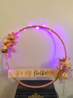 a birthday decoration with flowers and lights on it's headband that says its my birthday