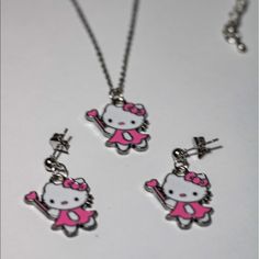 High Quality Silver Stainless Steel Hello Kitty Necklace And Earrings Set. Features 1. Material: Stainless Steel ,Green Vacuum Plating Nickle And Lead Free. High Quality. 2. Pendant Size:11mm*13mm Necklace Chain Length:41cm,Weight:3g 3. Color:Steel Cute Metal Jewelry With Cat Design, Hello Kitty Sterling Silver Jewelry Gift, Hello Kitty Sterling Silver Necklace, White Sterling Silver Hello Kitty Jewelry, Cute Silver Dangle Jewelry, Pink Hello Kitty Sterling Silver Jewelry, Cute Cat Design Dangle Jewelry, Clear Things, Hello Kitty Necklace