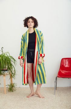 Designer Ellen Van Dusen doubles down on her love of stripes with this cotton-terry robe playfully patterned with a contrasting interior colorway and tie. 46" length (size Medium) Shawl collar Front patch pockets Removable tie belt 100% cotton Machine wash, tumble dry Made in Portugal Striped Long Sleeve Robe For Loungewear, Multicolor Cotton Outerwear For Loungewear, Cotton Robe With Tie Waist, Long Sleeve Cotton Robe With Tie Waist, Multicolor Cotton Robe For Loungewear, Multicolor Cotton Beach Outerwear, Multicolor Cotton Robe For Spring, Dusen Dusen, Terry Robe