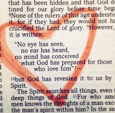 an open book with a heart drawn on it and the words god has revealed in red