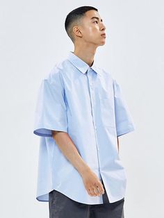 Editor's NotesThis casual oversized button-down shirt is made from high-density cotton-nylon blend. It's designed with a single pocket and reversed seam finish.- Collared neck- Button fastenings- One chest pocket- Drop shoulder- Short sleeves- Curved hem- Oversized fitMeasurements (in.) M / L- Shoulder: 22.2 in. / 22.8 in. - Chest: 23.8 in. / 24.6 in.  - Sleeve Length: 10.8 in. / 10.8 in. - Total Length: 30.7 in. / 31.3 in.  Composition & Care- 69% Cotton, 31% Nylon- Dry clean- Do not tumble Blue Shirt With Pockets For Streetwear, Oversized Button-up Short Sleeve Shirt With Pockets, Oversized Short Sleeve Button-up Shirt With Pockets, Oversized Cotton Short Sleeve Shirt With Pockets, Oversized Blue Shirt With Rolled Sleeves, Modern Blue Tops With Pockets, Solid Shirt With Pockets And Shirttail Hem, Modern Oversized Shirt With Pockets, Oversized Classic Short Sleeve Shirt For Spring